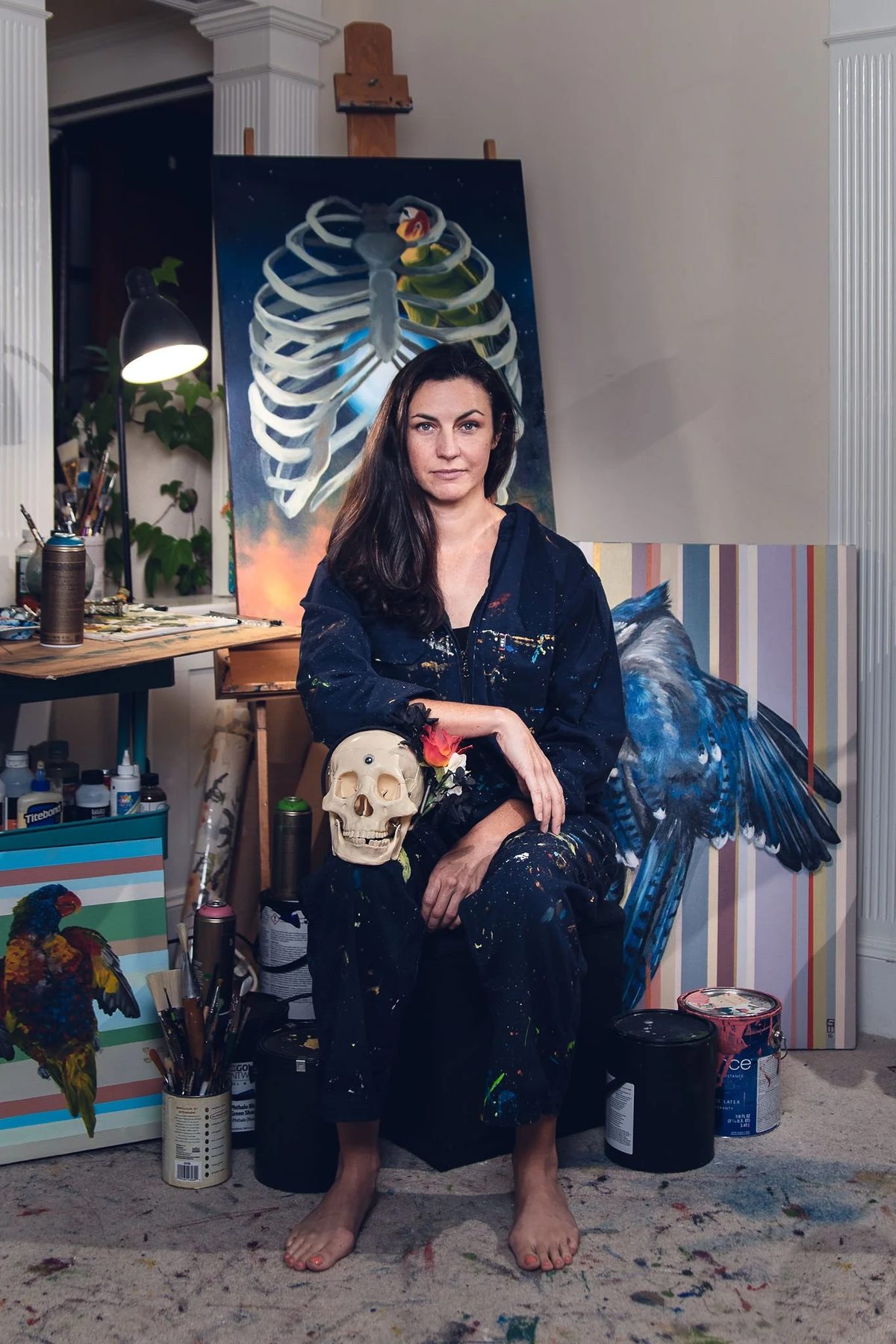 Sophy Tuttle in her studio, surrounded by nature paintings